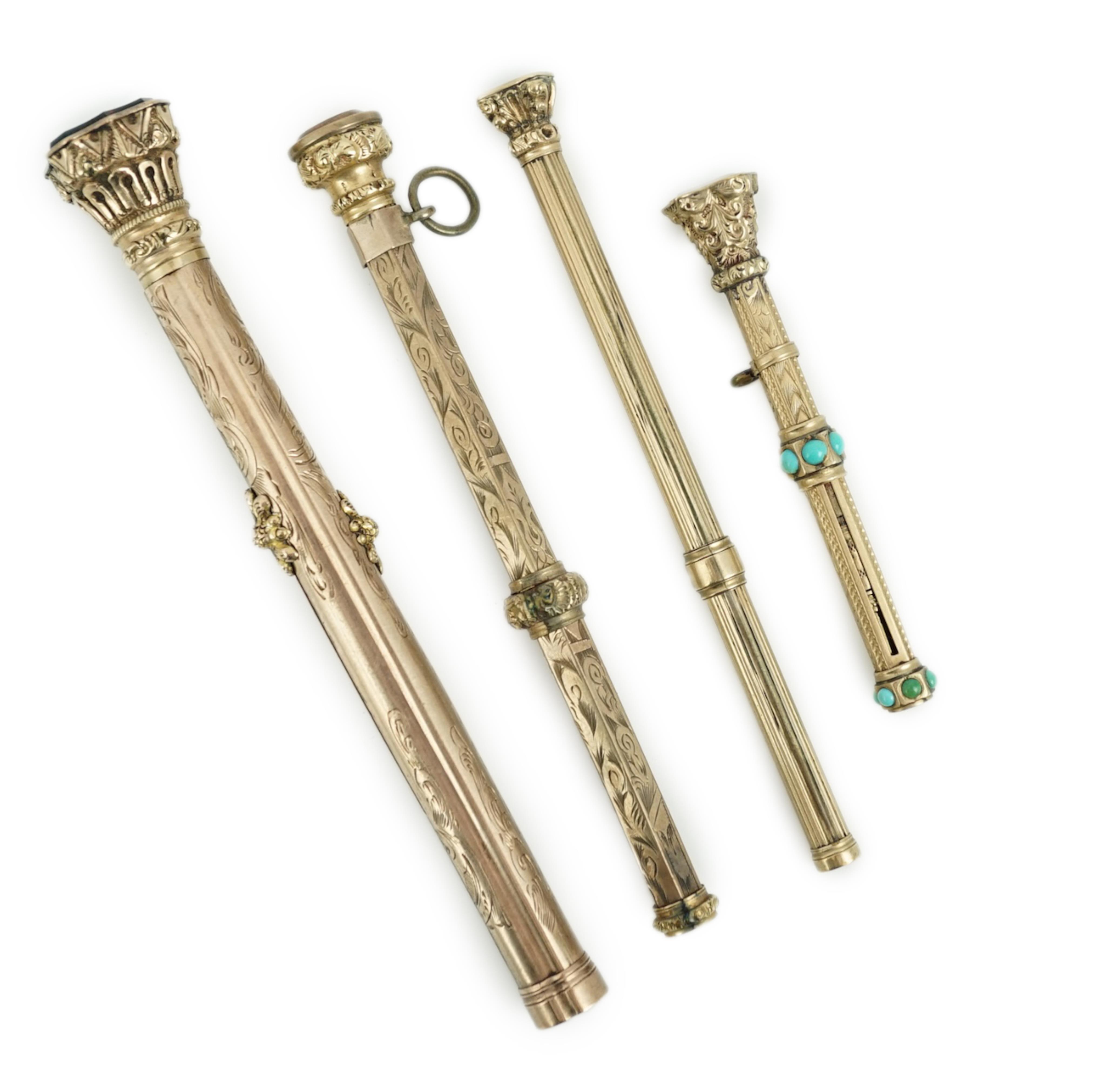 Four assorted late 19th/early 20th century yellow metal overlaid and gem set propelling pencils, largest set with bloodstone with pen and pencil, 97mm.